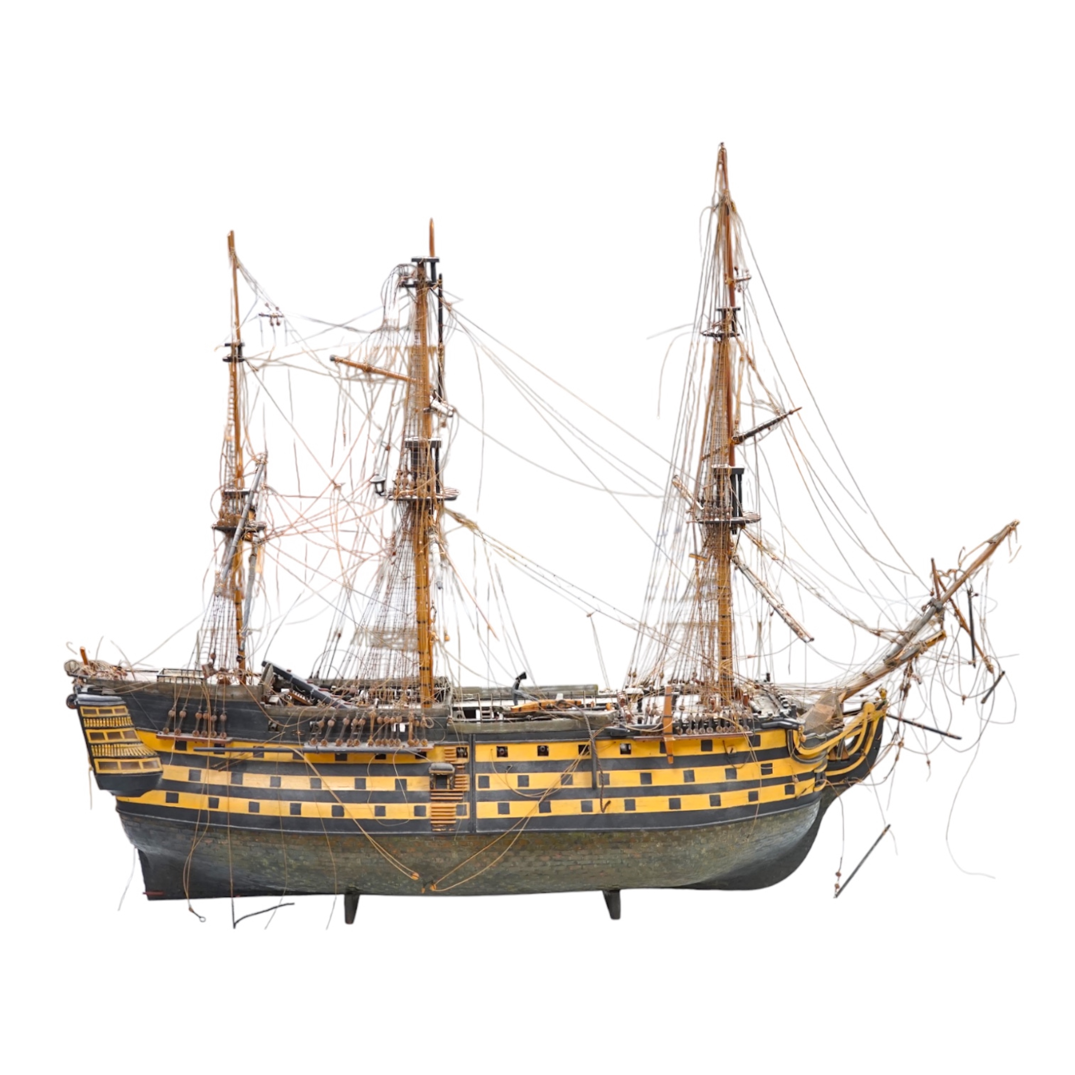 A large model of a rigged ship, 84cm long. Condition - fair